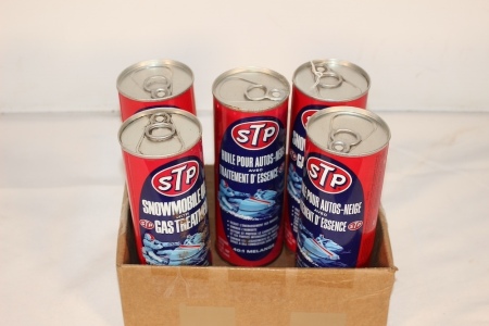 Cans of STP Snowmobile Oil (One Empty)