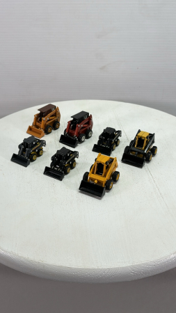 (7) Assorted Skid Steers