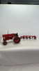 International 966 Tractor with 4 Furrow Plow