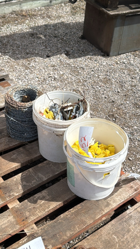 (2) Pails of Insulators and Small Roll of Barbwire