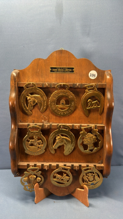 Quantity of Horse Brass on Wooden Rack