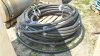 LARGE ROLL OF 1 1/4IN BLACK POLY PIPE - 4