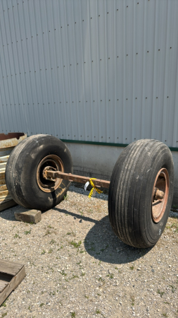 AXLE WITH (2) AIRPLANE TIRES