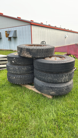 (7) 10.00-20 TIRES ON OPEN CENTER RIMS