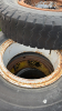(7) 10.00-20 TIRES ON OPEN CENTER RIMS - 4
