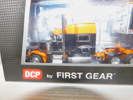 1/64 DCP Pete 379, Orange/Black w/Wilson Tri-Axle