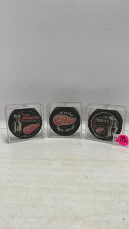 (3) Hockey Pucks