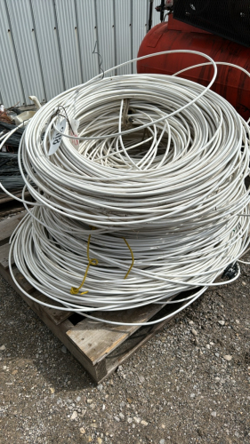 Skid of White Plastic Coated Electric Fence Wire