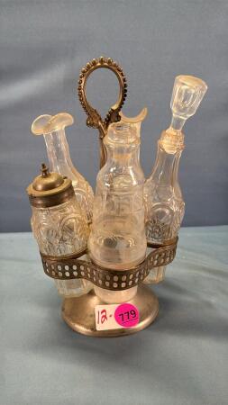 Cruet Stand with 4 Matching Bottles & 1 Odd
