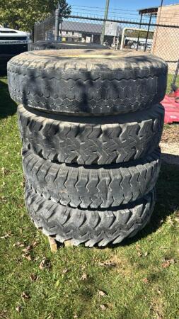 LOT OF 4 - 10.00-20 TIRES ON RIMS