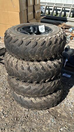 (4) CARLISLE 255/65-12 TIRES ON 4 BOLT RIMS