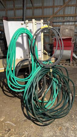 Metal Stand and 5 Garden Hoses