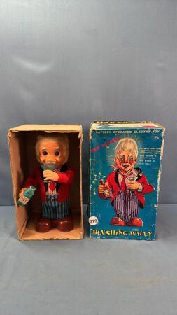 TIN BATTERY OPERATED BLUSHING WILLY TOY