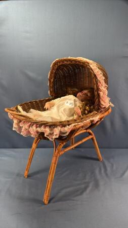 VANESSA PORCELAIN DOLL IN WICKER CRADLE