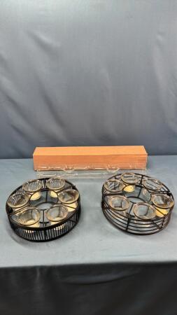 A QUANTITY OF GLASSES IN WIRE RACKS