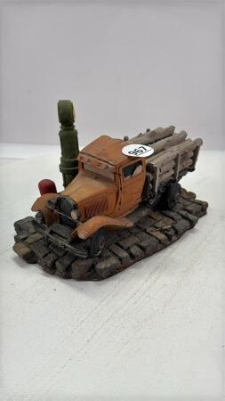 VINTAGE TRUCK SCULPTURE WITH GAS & LOAD OF LOGS