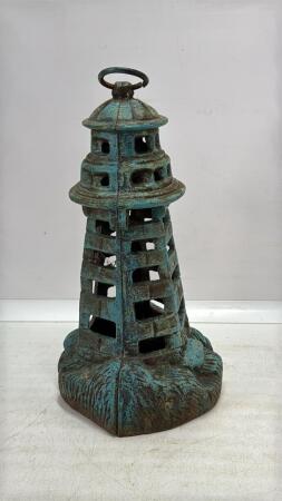 CAST IRON LIGHTHOUSE CANDLE HOLDER