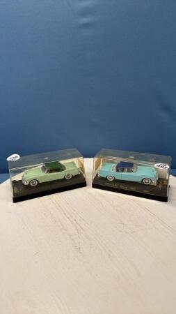 (2) 1957 STUDEBAKER CARS IN DISPLAY CASES