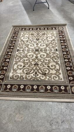 CHOCOLATE COLOURED AREA RUG