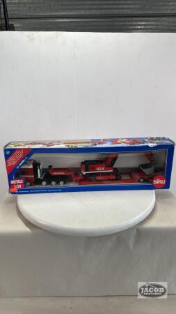 DAY CAB TRIAXLE TRUCK WITH DROP DECK TRAILER