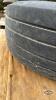 (1) USED 12.5X15 SL IMPLEMENT TIRE ON 6 BOLT HUB - 7
