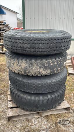 (4) 10-20 TIRES ON 8 BOLT RIMS