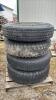 (4) 10-20 TIRES ON 8 BOLT RIMS