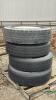 (4) 11R22.5 TIRES ON 8 BOLT RIMS