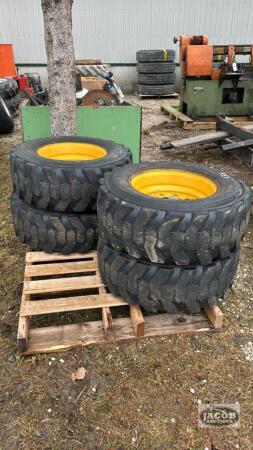 (4) SKID STEER TIRES ON RIMS 12-16.5NHS