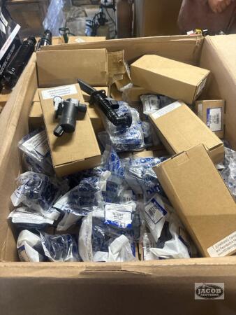 Box full of windshield washer pumps and misc fittings