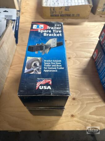 Two spare trailer tire brackets