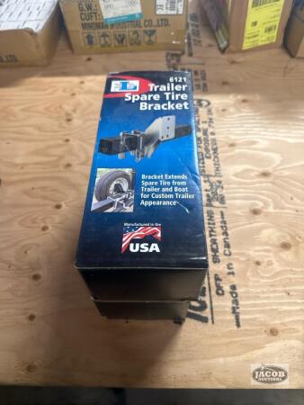 Two spare trailer tire brackets