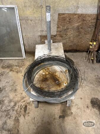 Roll of barbed wire and wire , dolley cart