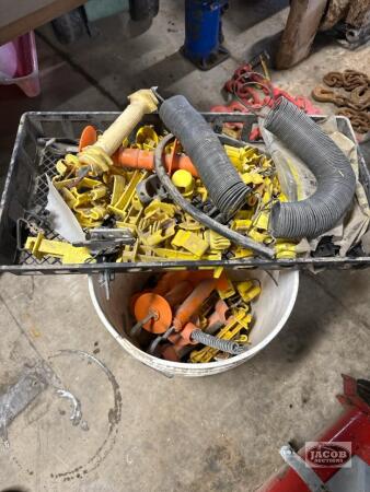 One tray and one bucket of fencing items