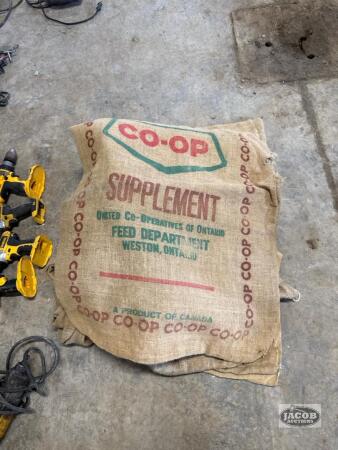 Approximately 20 burlap sacks