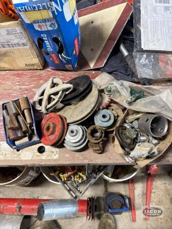 2 boxes of misc and 1 pile of pulleys misc