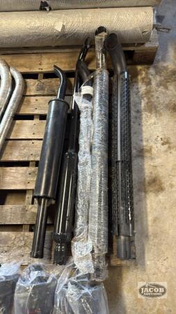 Five unused tractor mufflers