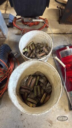 Two buckets of unused pins