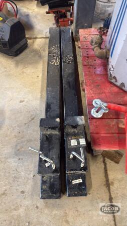 Pair of unused clamp on bucket pallet forks