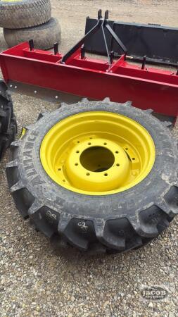 Unused Alliance 280/85R24 tire on Jd 8 bolt wheel x2