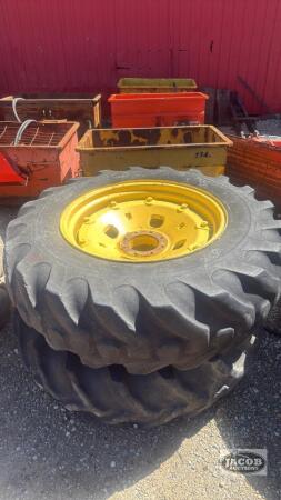 Pair of 14.9 -28 tires on Jd 8 bolt cast wheels