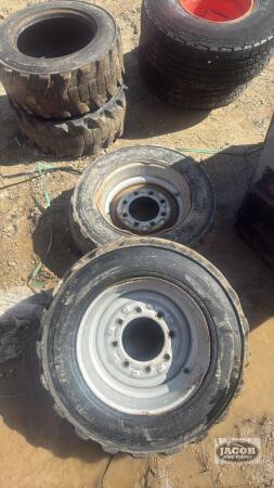 Pair of 10-16.5 tires on 8 bolt wheels