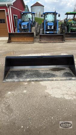 Unused 78in skid steer quick tach bucket
