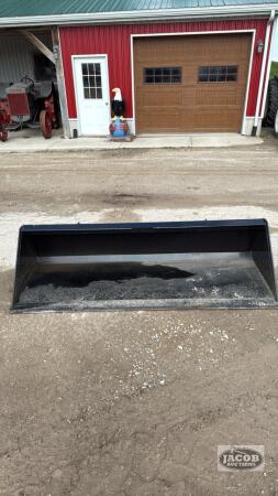 Unused 84in skid steer quick tach bucket