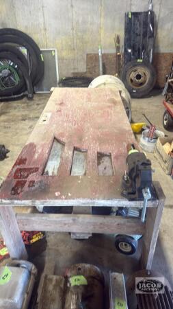 Wooden table with bench vise