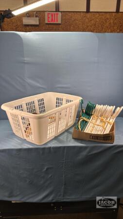 LAUNDRY BASKET WITH APPROX. 24 HANGERS