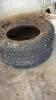 (2) UNMATCHED TIRES - 4