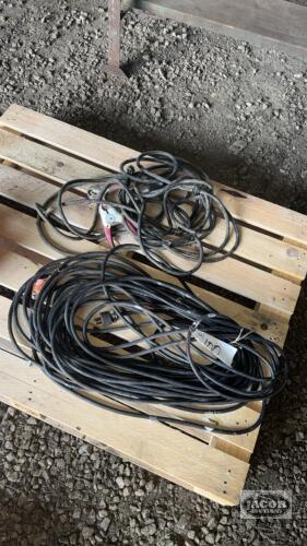 A LOT OF EXTENSION CORDS AND BOOSTER CABLES