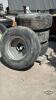 (4) UNMATCHED 385/65R22.5 TIRES ON 8 BOLT RIMS