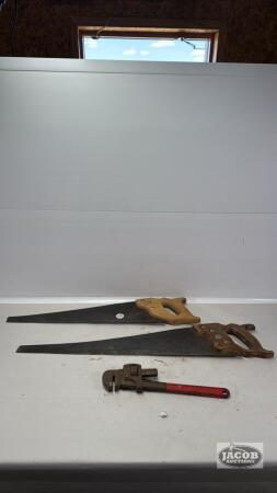 (2) HAND SAWS AND ONE 14IN STEEL PIPE WRENCH